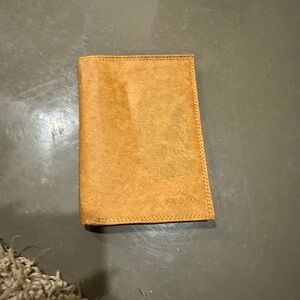 Vintage tan leather tri-fold wallet